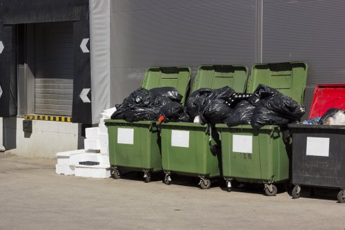 Supervisor documenting an incident report beside a waste vehicle